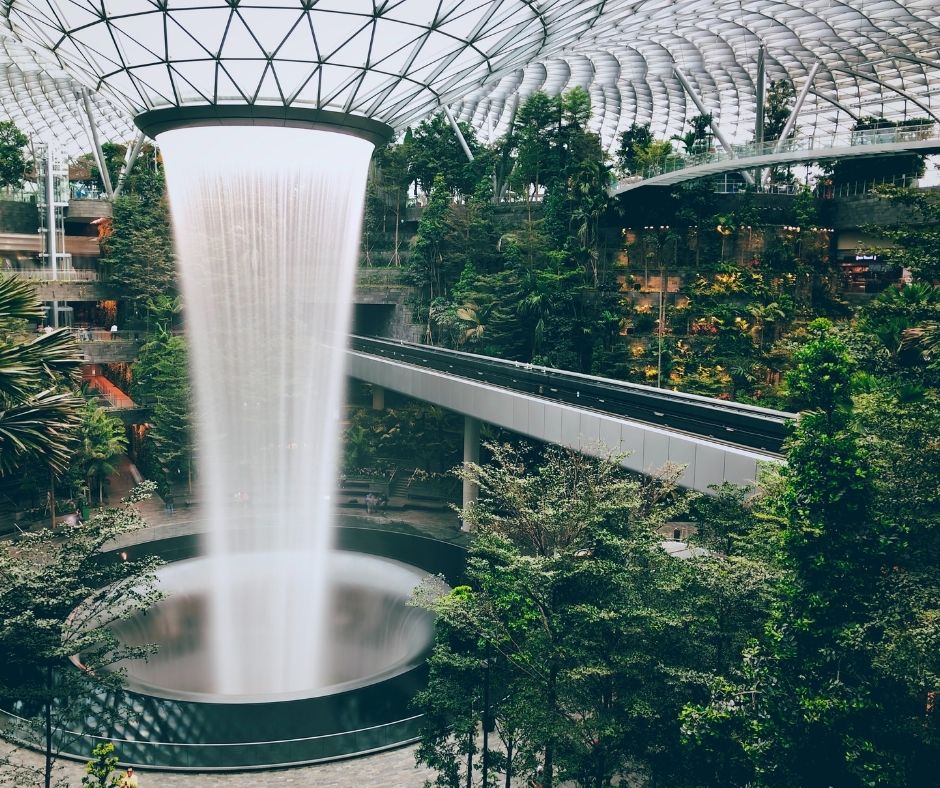 The indoor waterfall surrounded by gardens at Singapore's Changi International Airport
